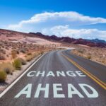 Change management visual - a road through a desert that says change ahead