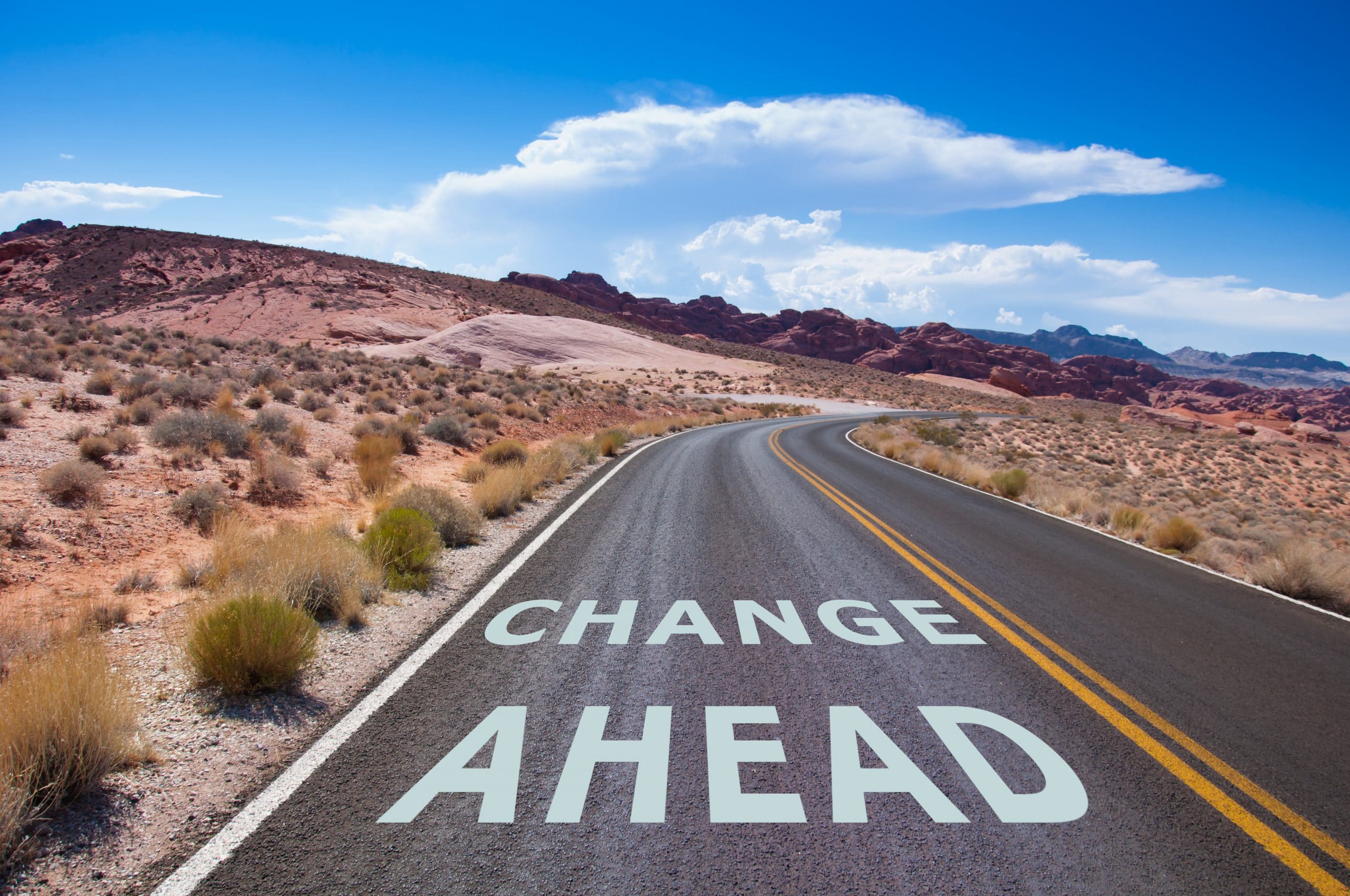 Change management visual - a road through a desert that says change ahead
