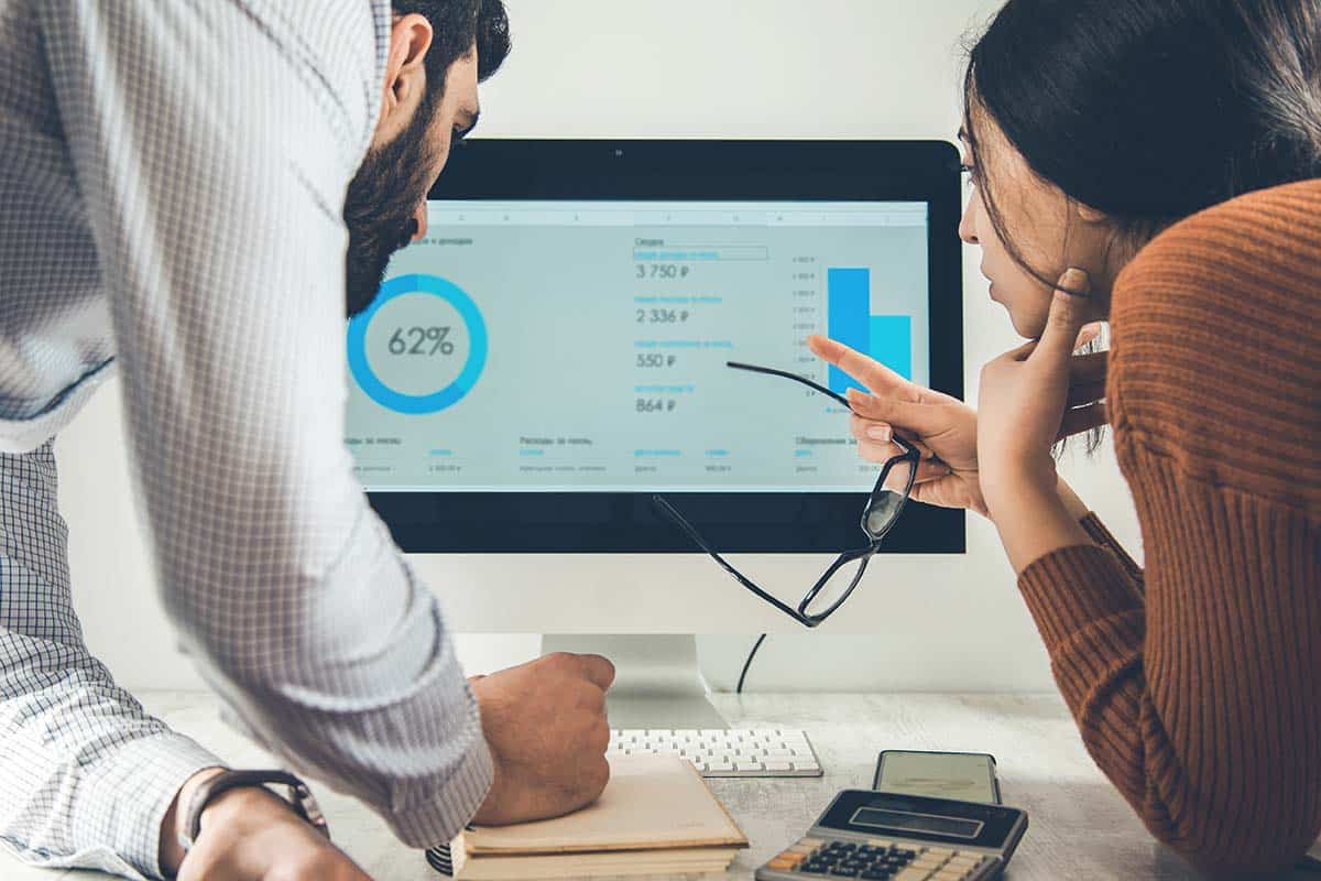 Two coworkers analyze insurance data