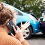 Female Motorist Involved In Car Accident Calling Insurance Company to Make a Claim