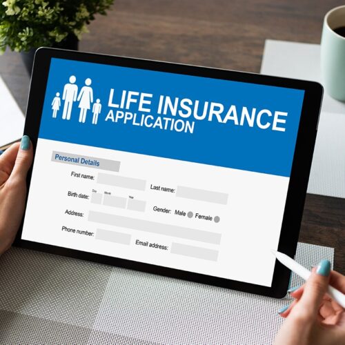 Woman completes online life insurance application on a tablet