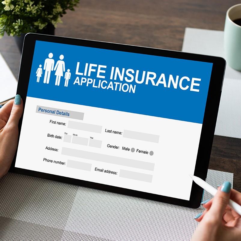 Woman completes online life insurance application on a tablet - a life insurer gains a perspective on digital capabilties