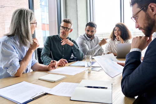 Diverse,International,Executive,Business,Partners,Group,Discuss,Report,At,Boardroom