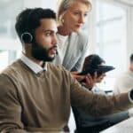 Contact center environment with a mentor and training on a desktop computer